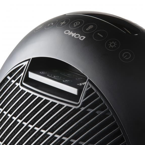 Black and gray air purifier. Top view, with control buttons, and a remote control. Detailed close-up.