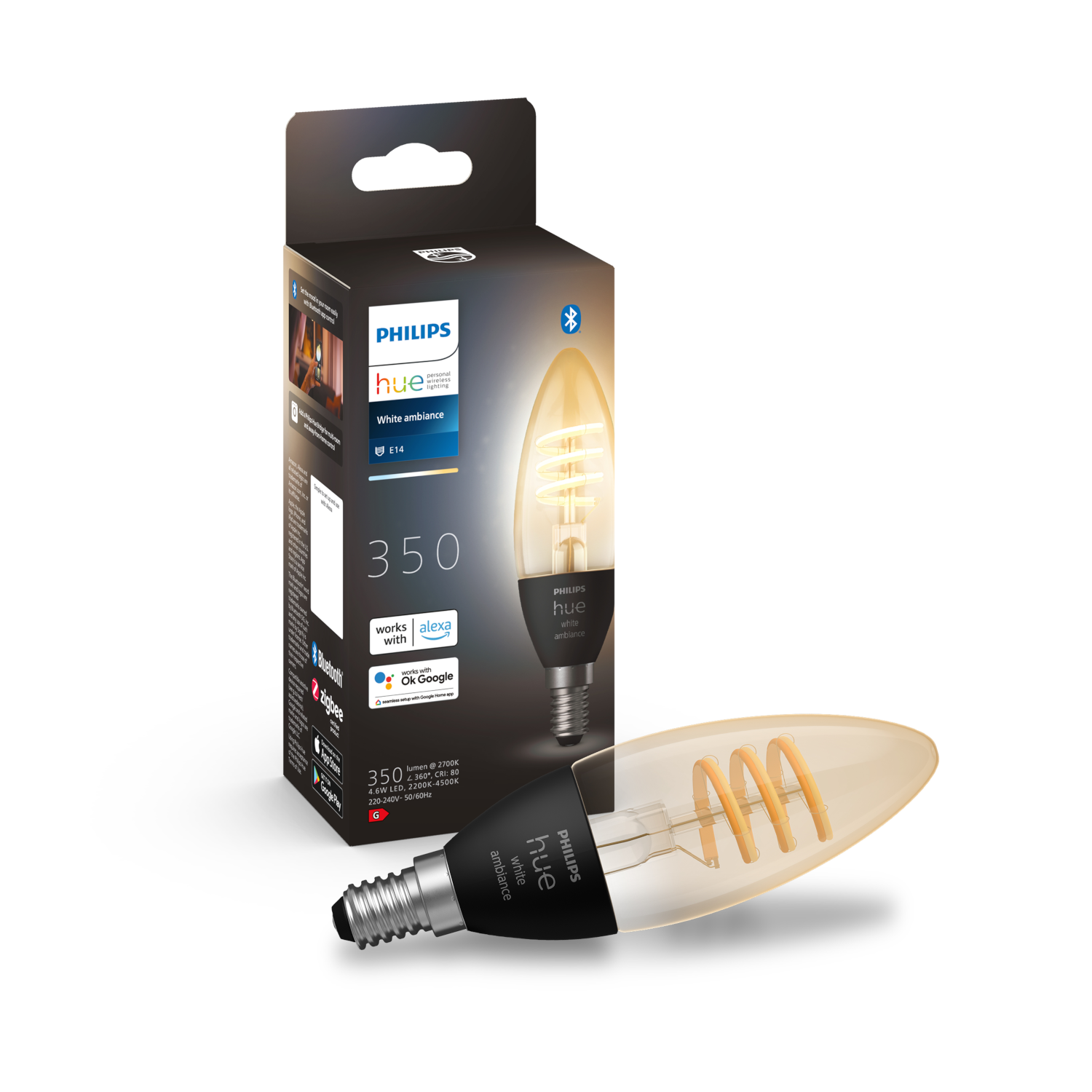 A light bulb and its box. The bulb has a spiral filament and is lit.