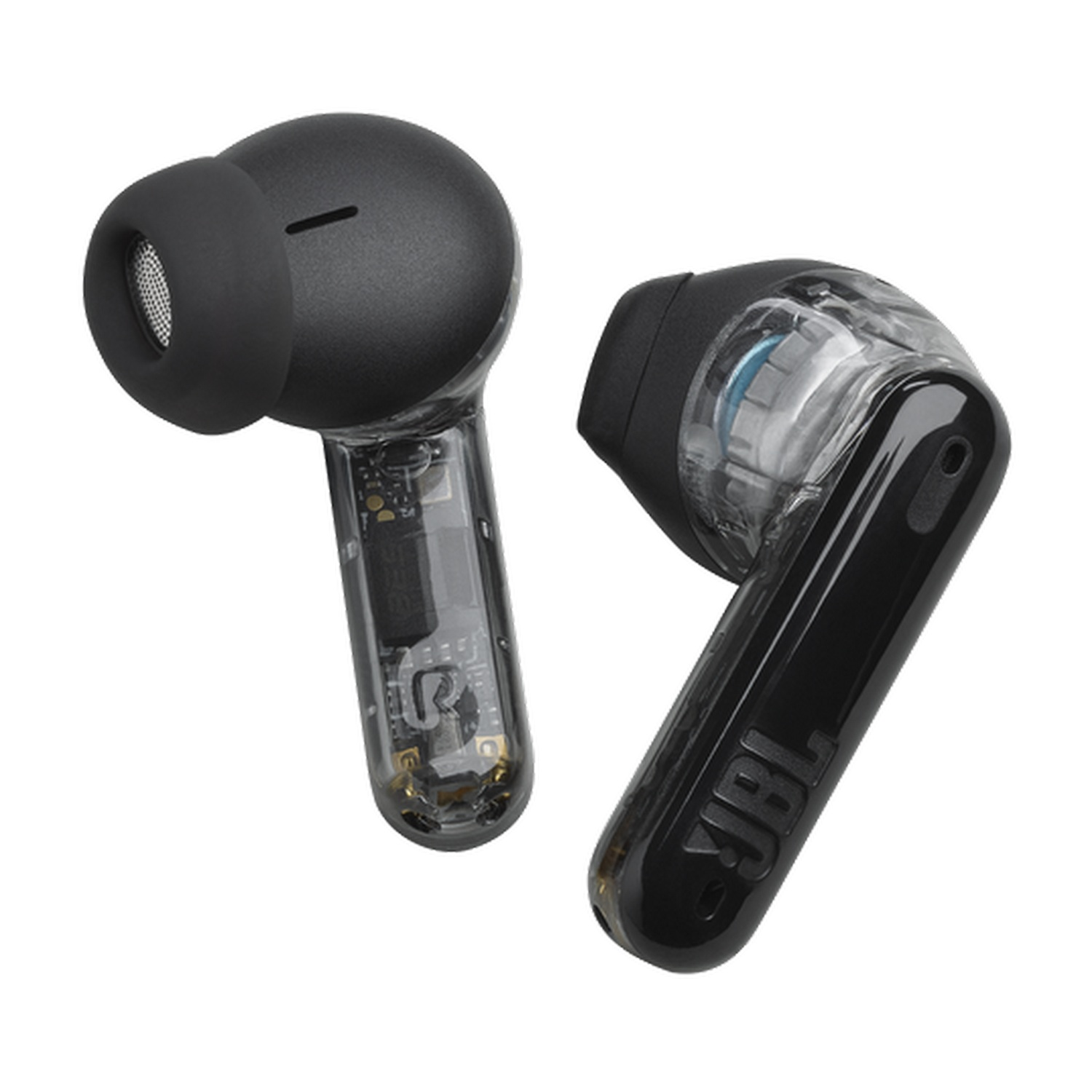 Dos auriculares JBL negros, uno muestra componentes internos. Aislados sobre fondo blanco.