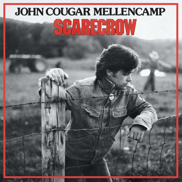 Albumcover mit einem Mann, der sich an einen Zaun lehnt, mit dem Titel 'Scarecrow' und John Cougar Mellencamp.