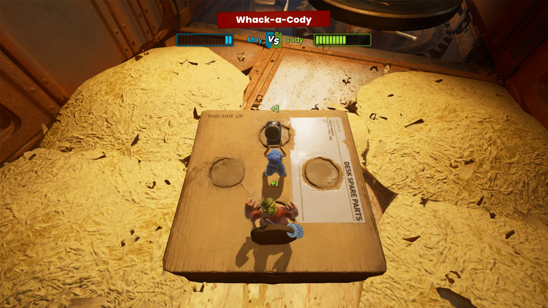 Eine Spielszene mit zwei Figuren auf einem Karton, Titel Whack-a-Cody.