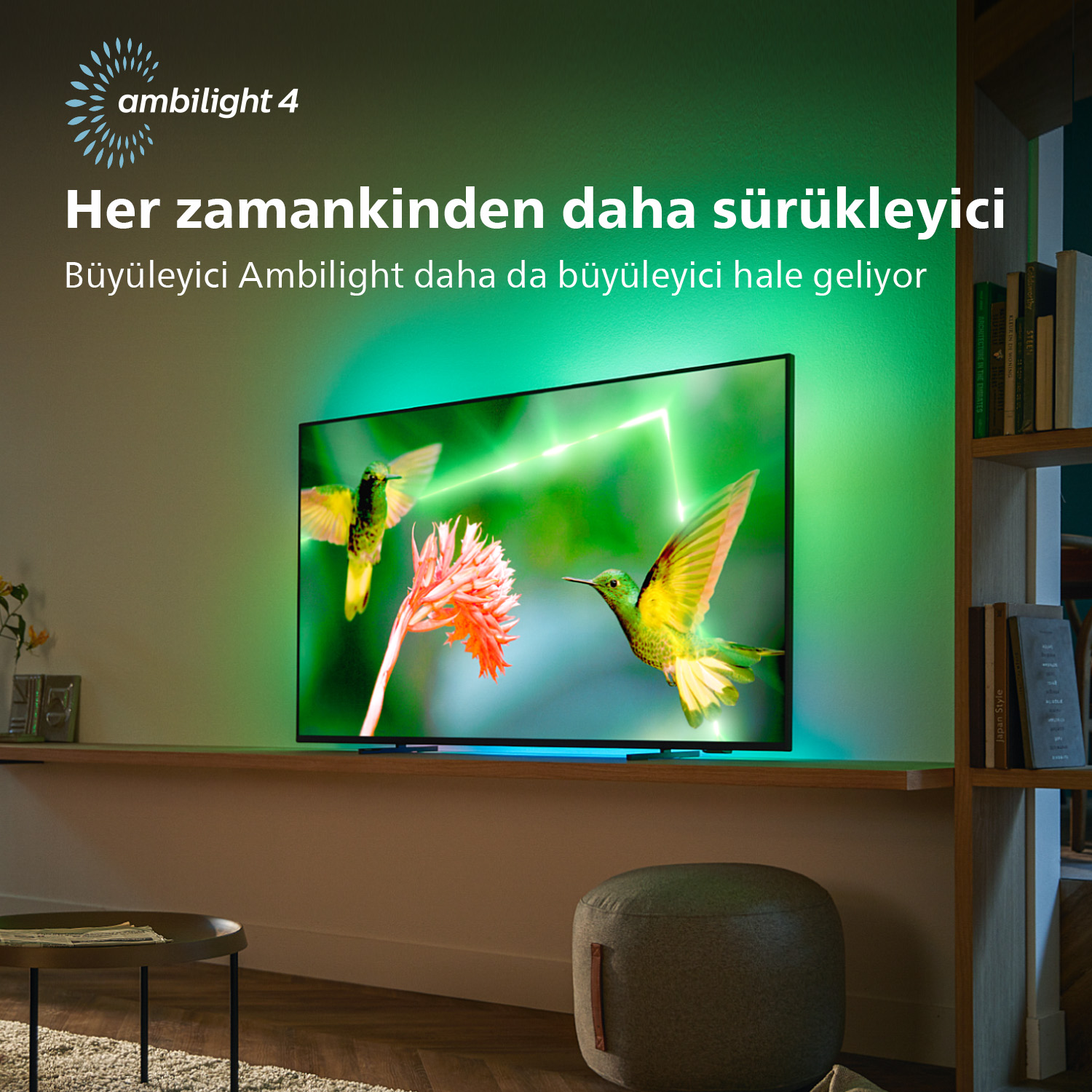 Philips Ambilight TV. Yeşil ve mavi aydınlatmalı bir ekranın önünde sinek kuşları uçuyor.