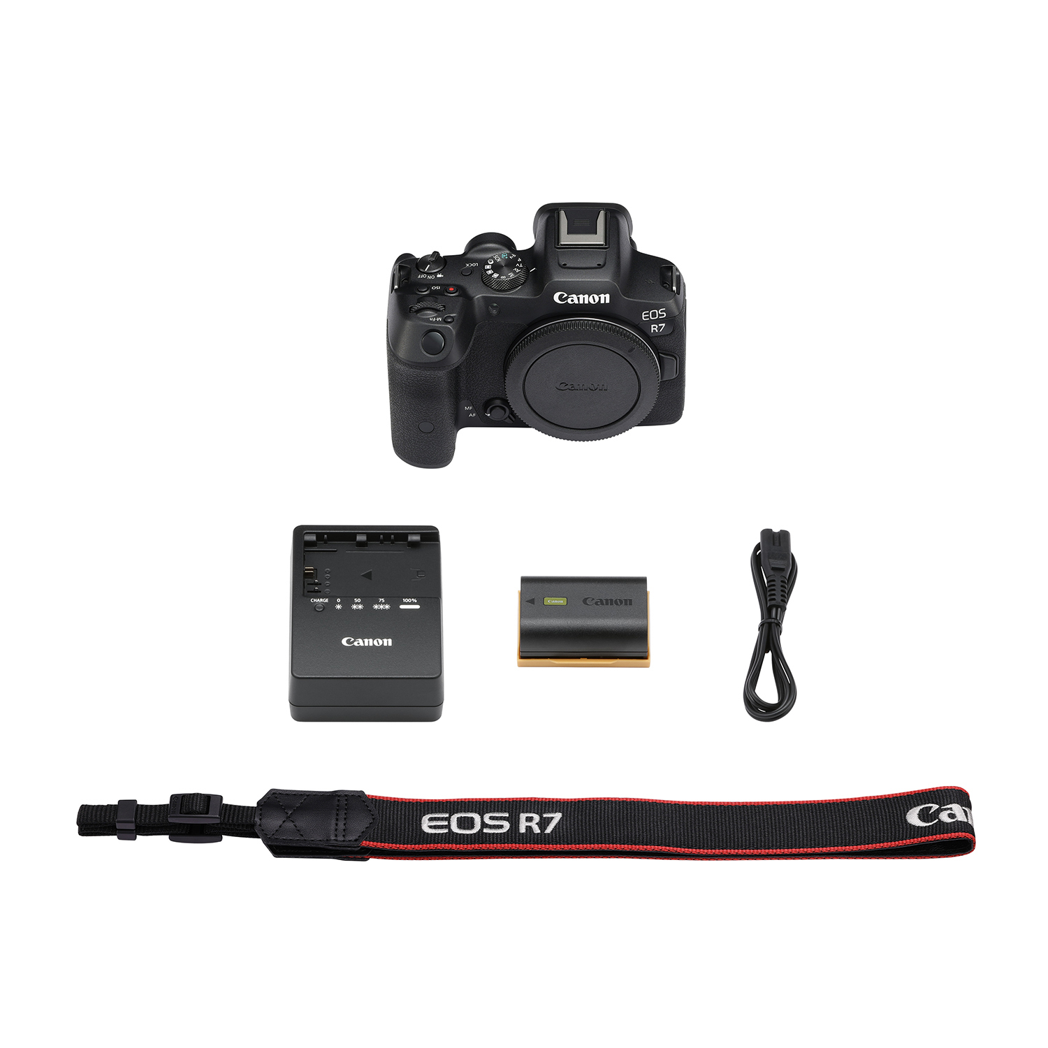 Una fotocamera Canon EOS R7 con caricabatterie, batteria, cinturino e cavo.