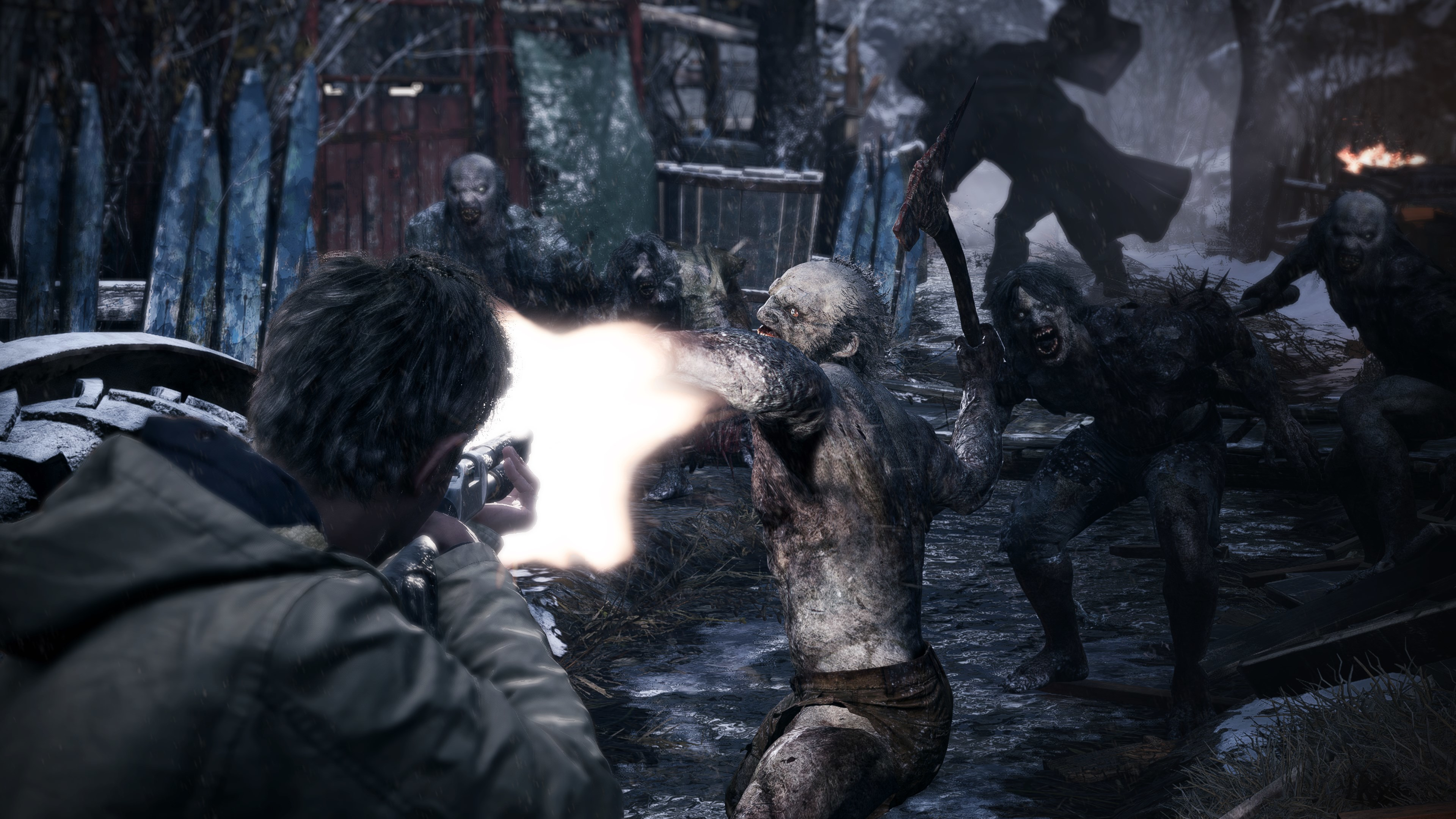 Ein Mann erschießt Zombies in einer Winterszene aus einem Videospiel.