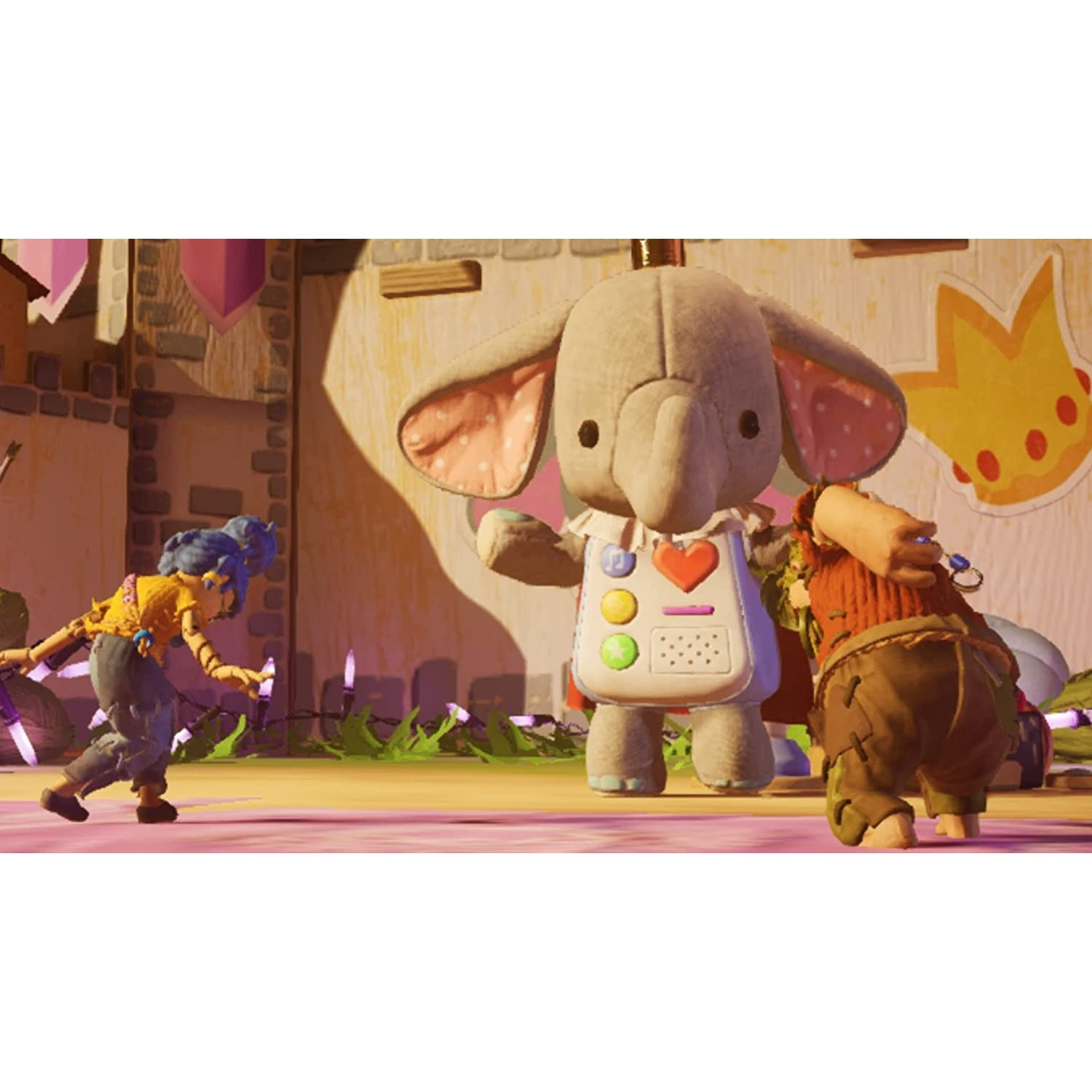 Una escena de It Takes Two: dos personajes con un juguete de elefante en un juego.