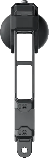 Gros plan d'un appareil rectangulaire noir. Il a un trou au milieu et un dessus arrondi.