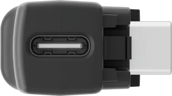 Schwarzer USB-C-Adapter mit weißem Anschluss. Der Anschluss ist rechteckig, der Adapter ein abgerundetes Rechteck.