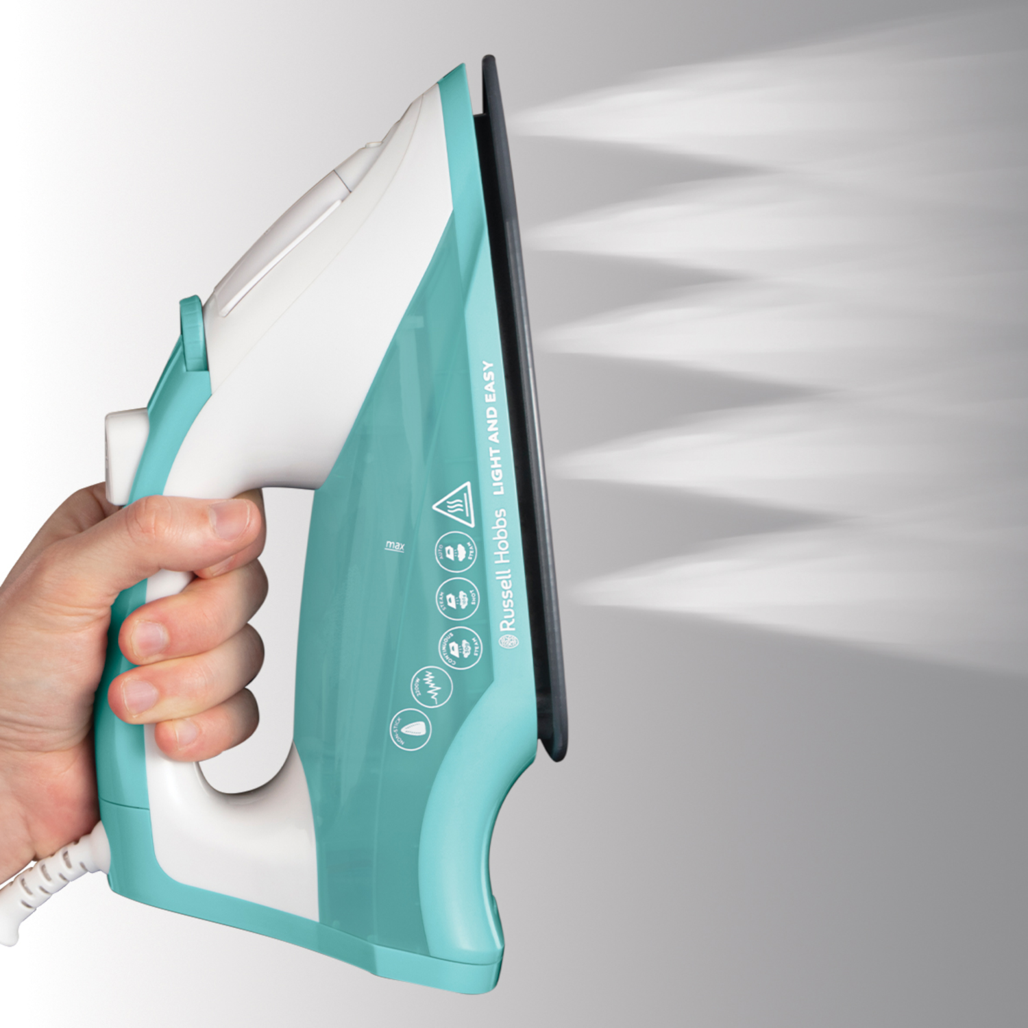A turquoise and white iron with steam. A hand is holding the iron, water vapor is coming out.