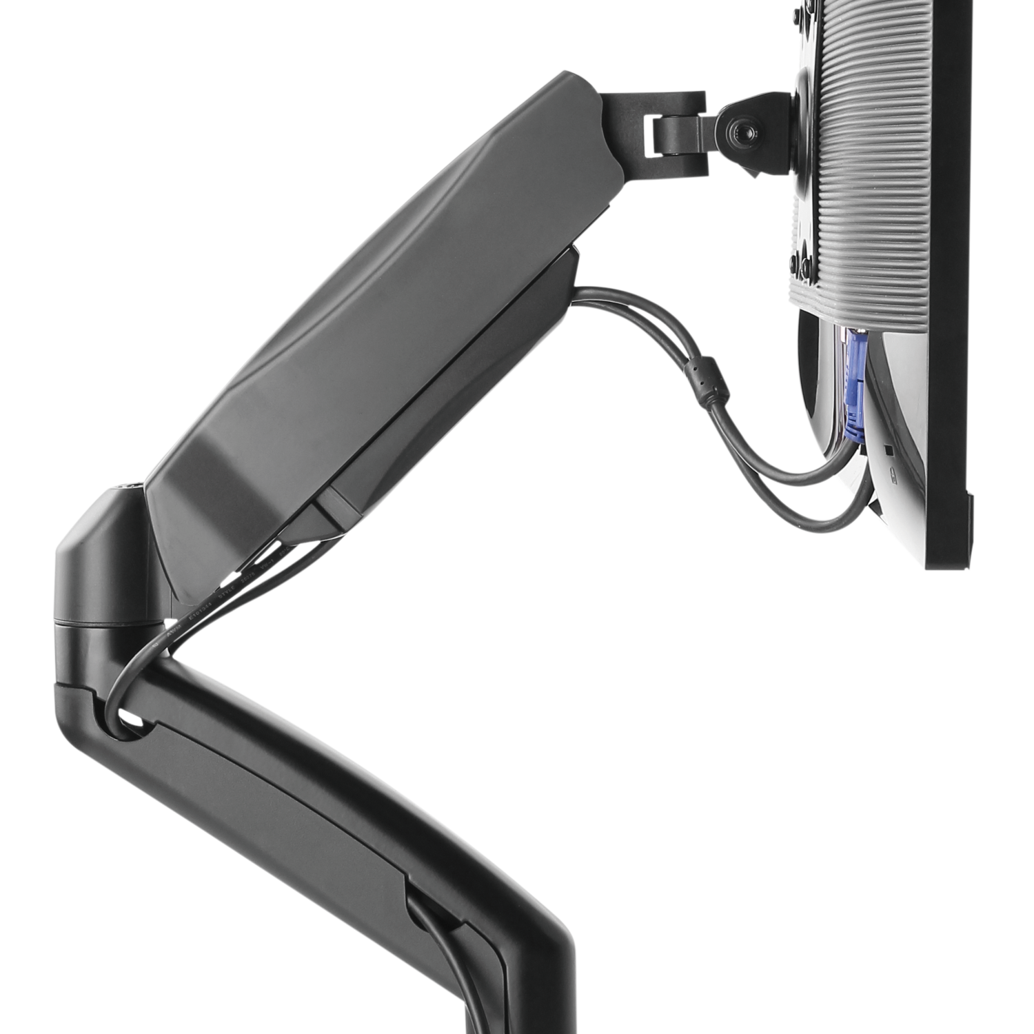 A black monitor arm supports a computer monitor against a black background.