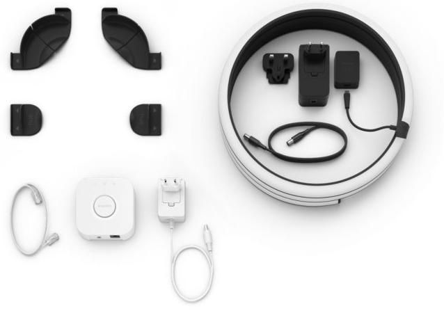White Philips Hue components: light, adapter, and accessories.