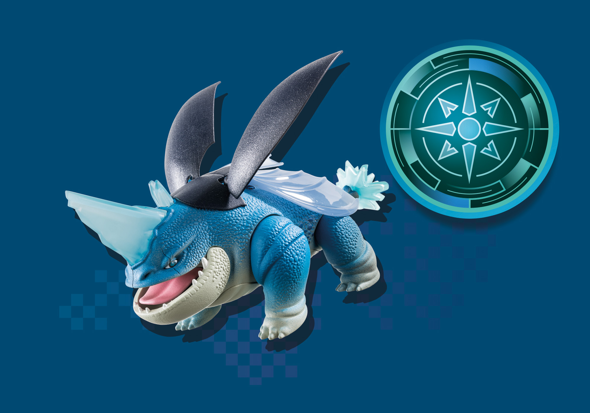 Ein blaues Spielzeugdrachen mit transparenten Flügeln und einem kreisförmigen Emblem auf blauer Fläche.