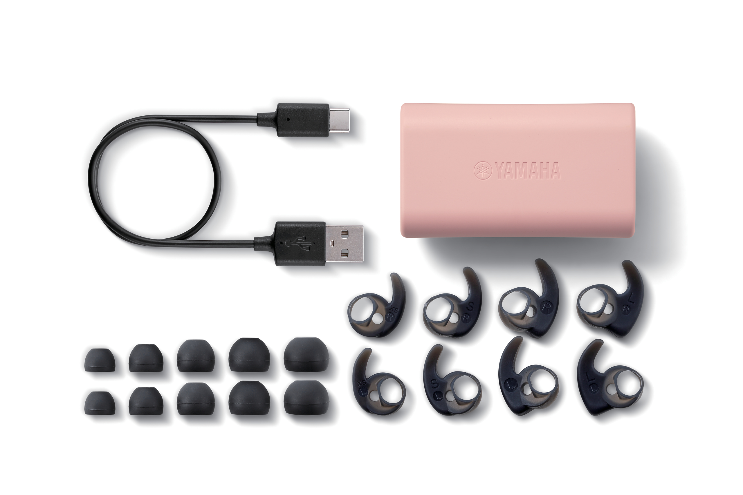 Ohrhörer, Etui und Zubehör, alles in Rosa und Schwarz.