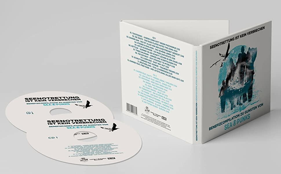 CD-Hülle mit zwei CDs. Hülle und CDs haben schwarze und blaue Grafiken und Text.
