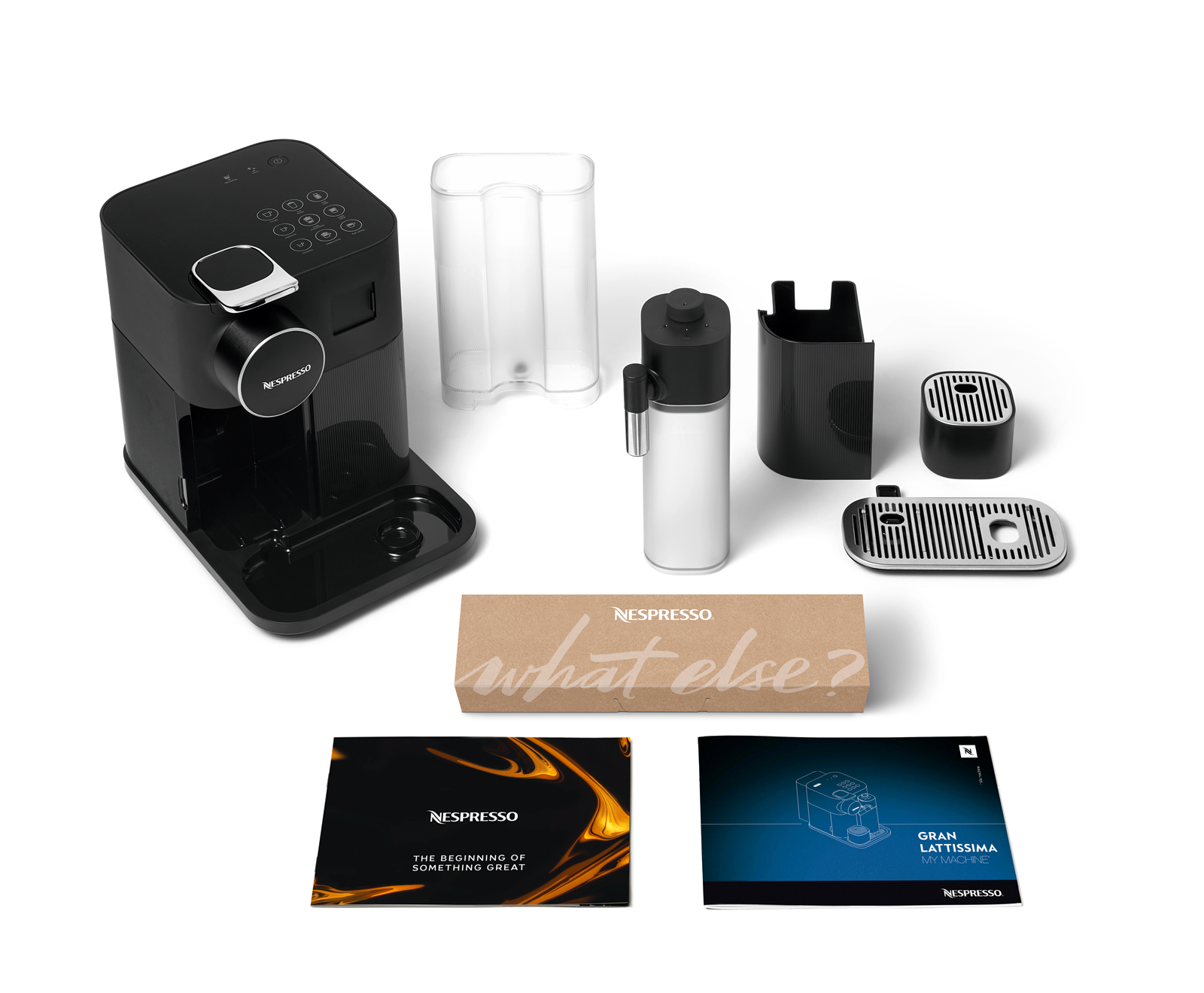 Siyah Nespresso kahve makinesi, bileşenler, bir kutu ve kullanım kılavuzları ile.