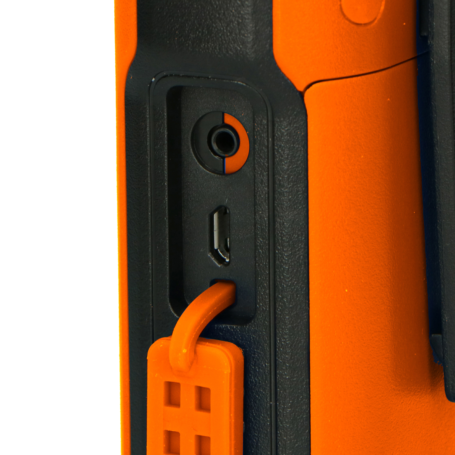 Close-up of an orange device, with a headphone jack and USB port visible.
