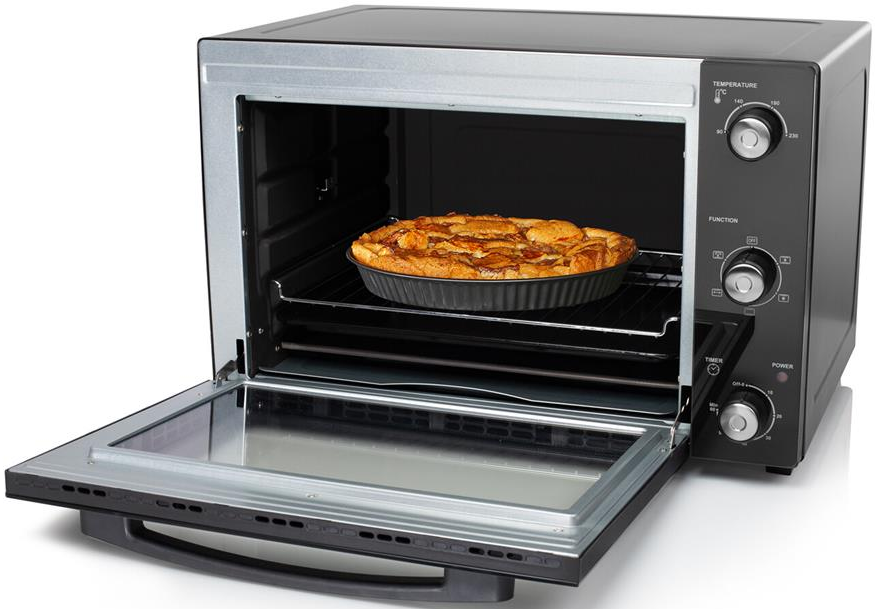 Un four avec la porte ouverte et une tarte à l'intérieur sur une grille.