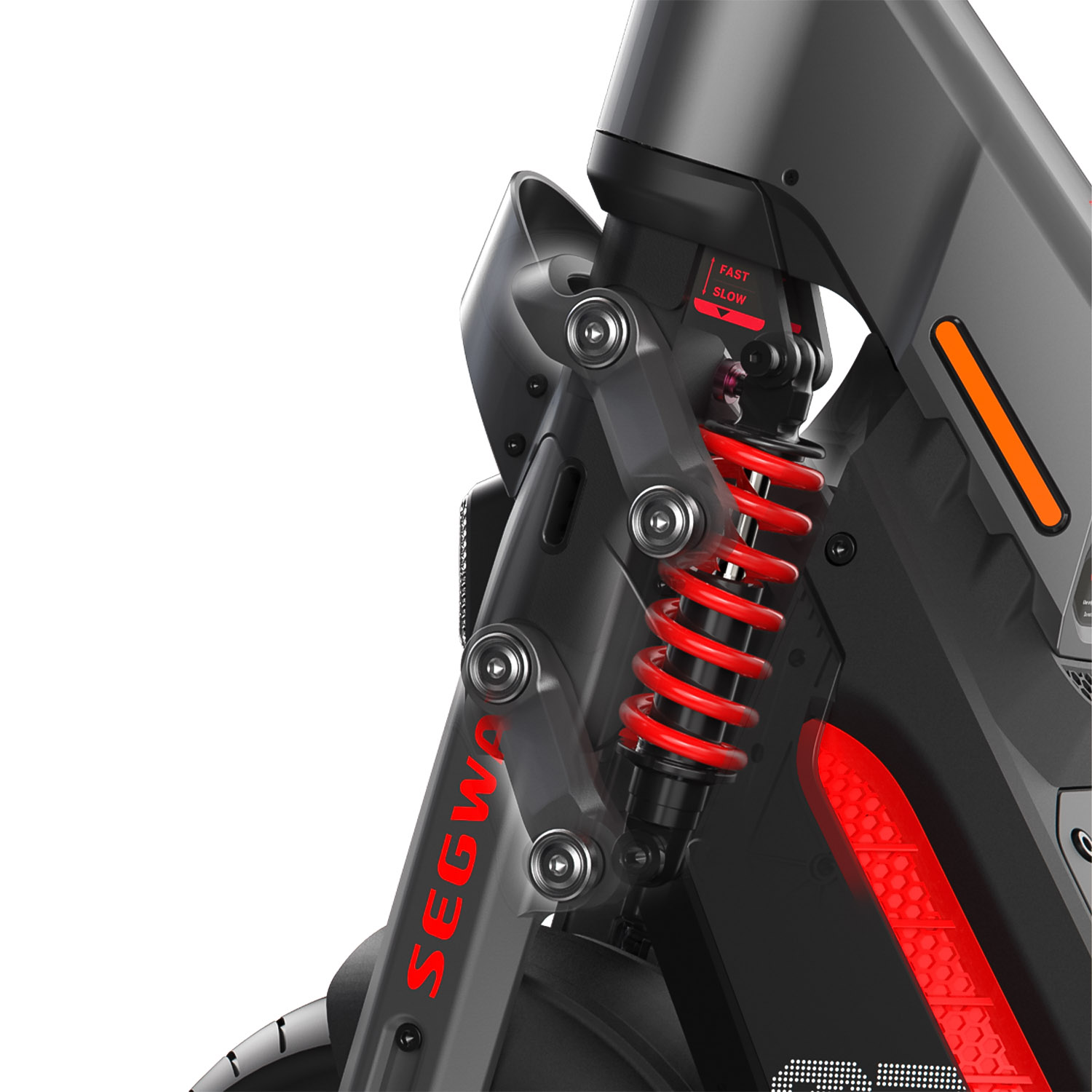 Primo piano della sospensione di uno scooter nero e grigio. Una molla rossa e 'SEGWAY' sono visibili.