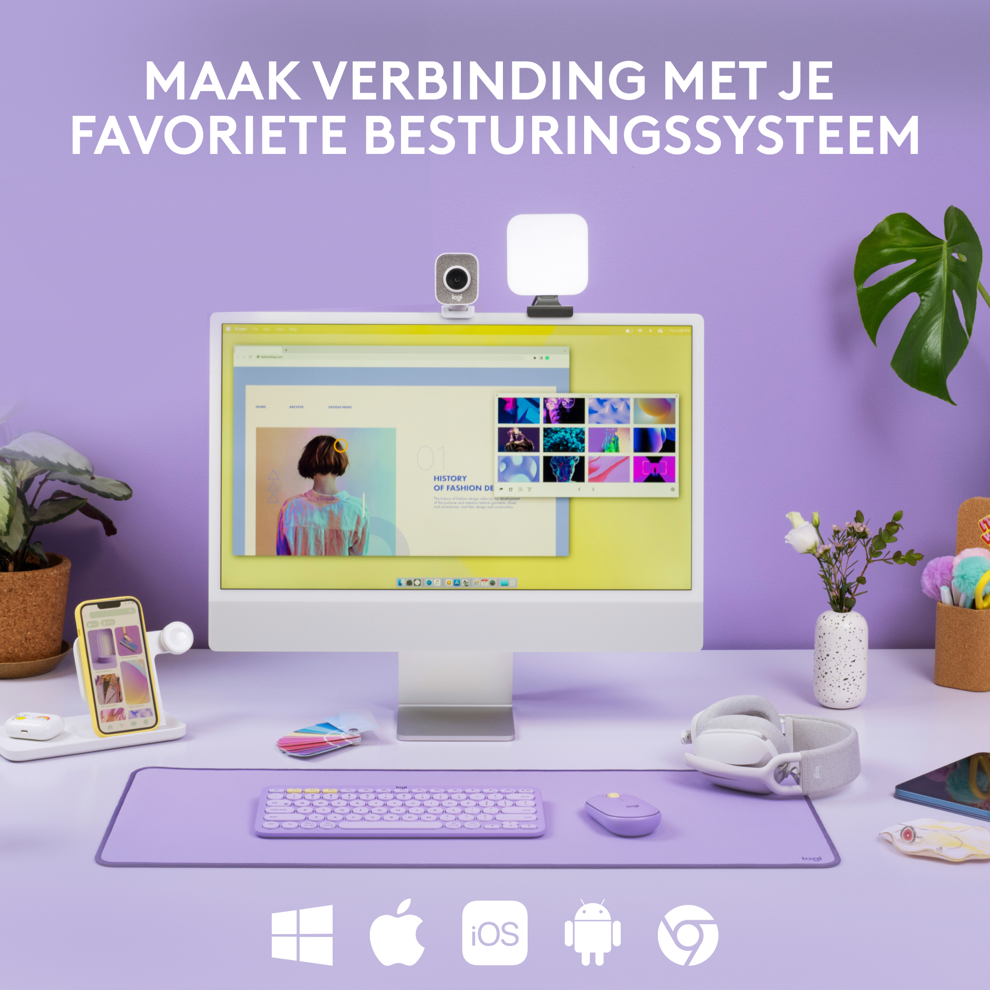 Bureau-opstelling met computer, telefoon, muis en accessoires. Op een paarse mat.