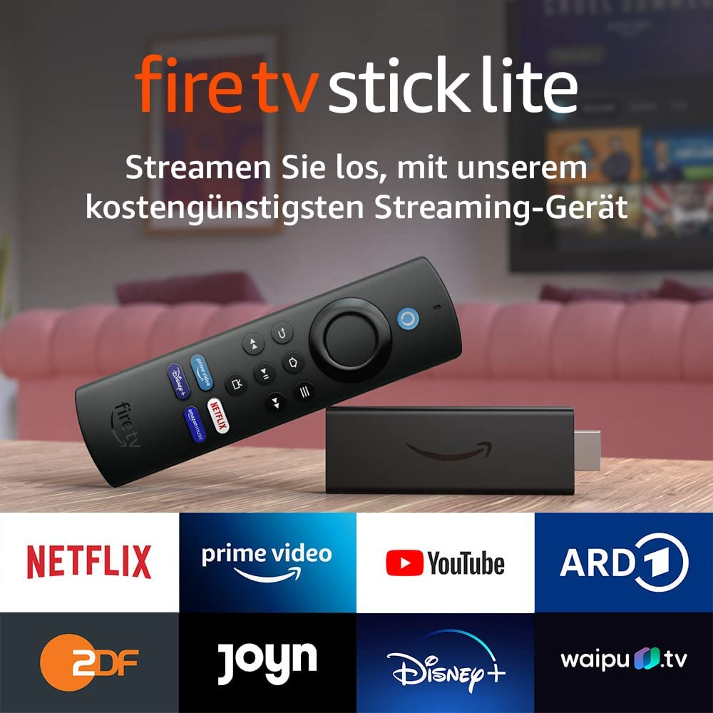 Fire TV Stick Lite avec télécommande et logos de services de streaming sur une table.