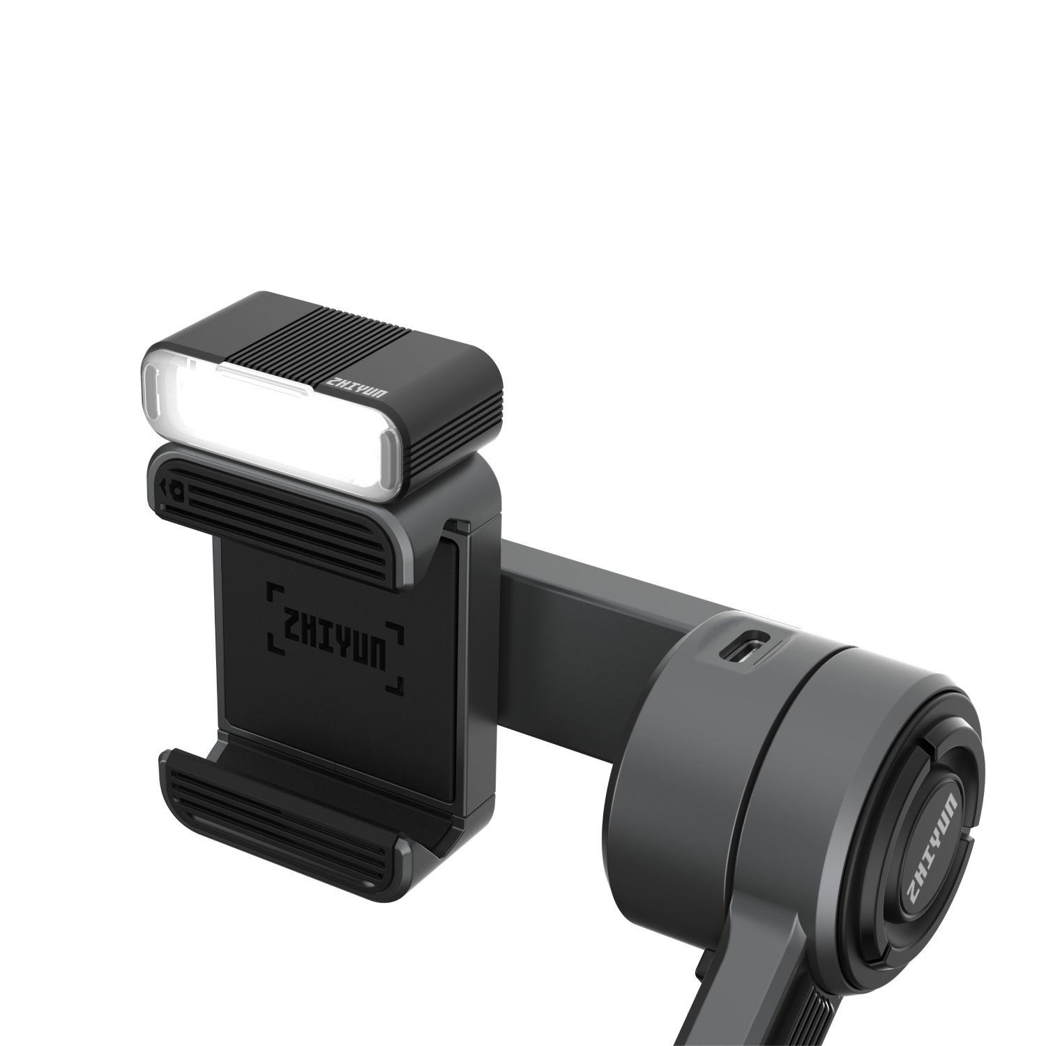 Zwarte Zhiyun gimbal met licht en telefoonhouder, tegen een zwarte achtergrond.