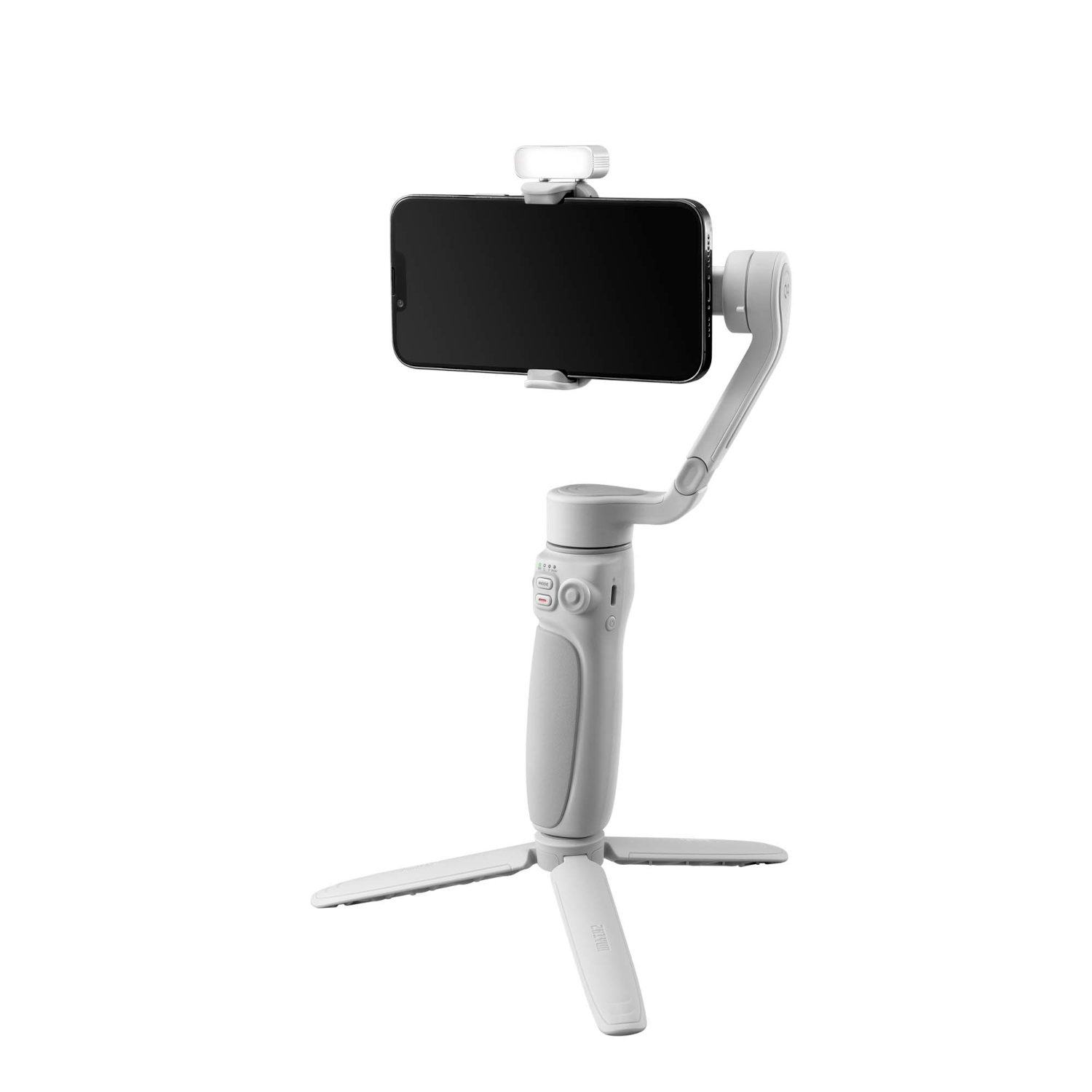 Witte gimbal met telefoon erop, op wit statief. Heeft een klein lampje bovenop.