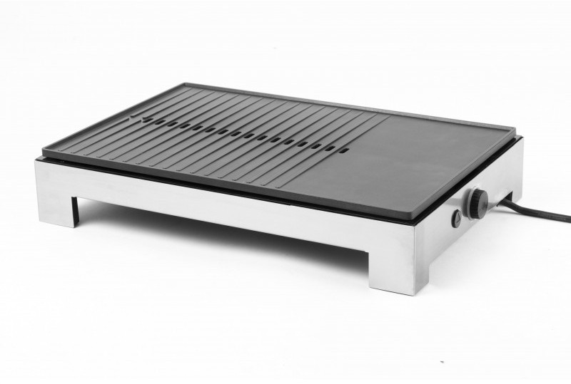 A silver electric grill. The grill is flat on the right and has ridges on the left side.
