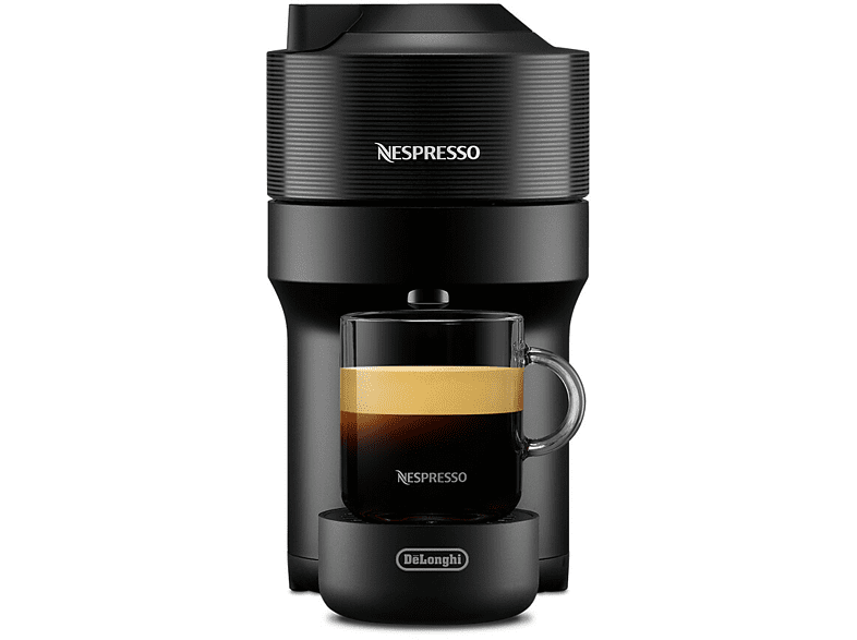 Fekete Nespresso gép, üveg kávéscsészével, fekete alapon.