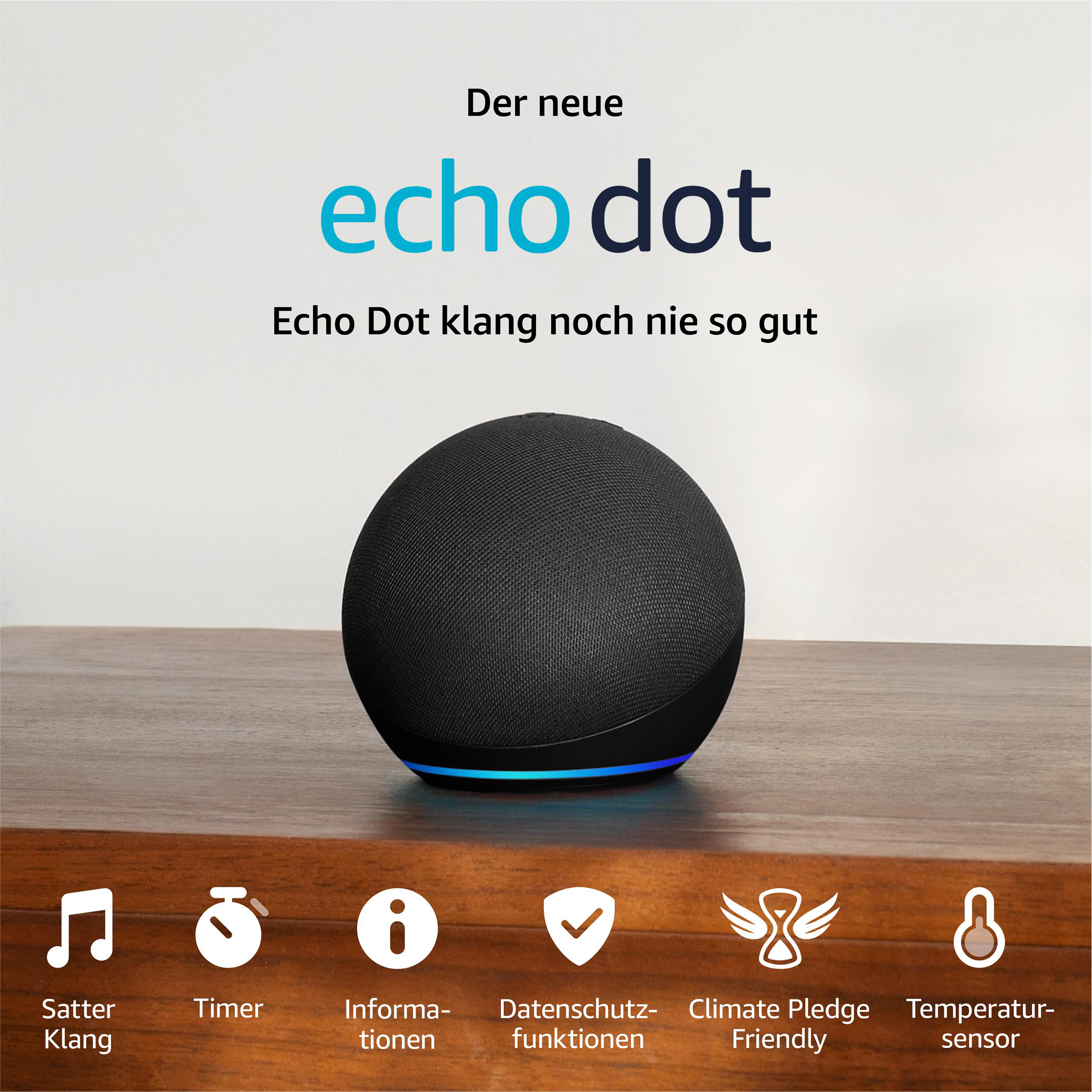 Schwarzer Echo Dot Lautsprecher auf Holztisch. Text: Echo Dot, Echo Dot klang besser.