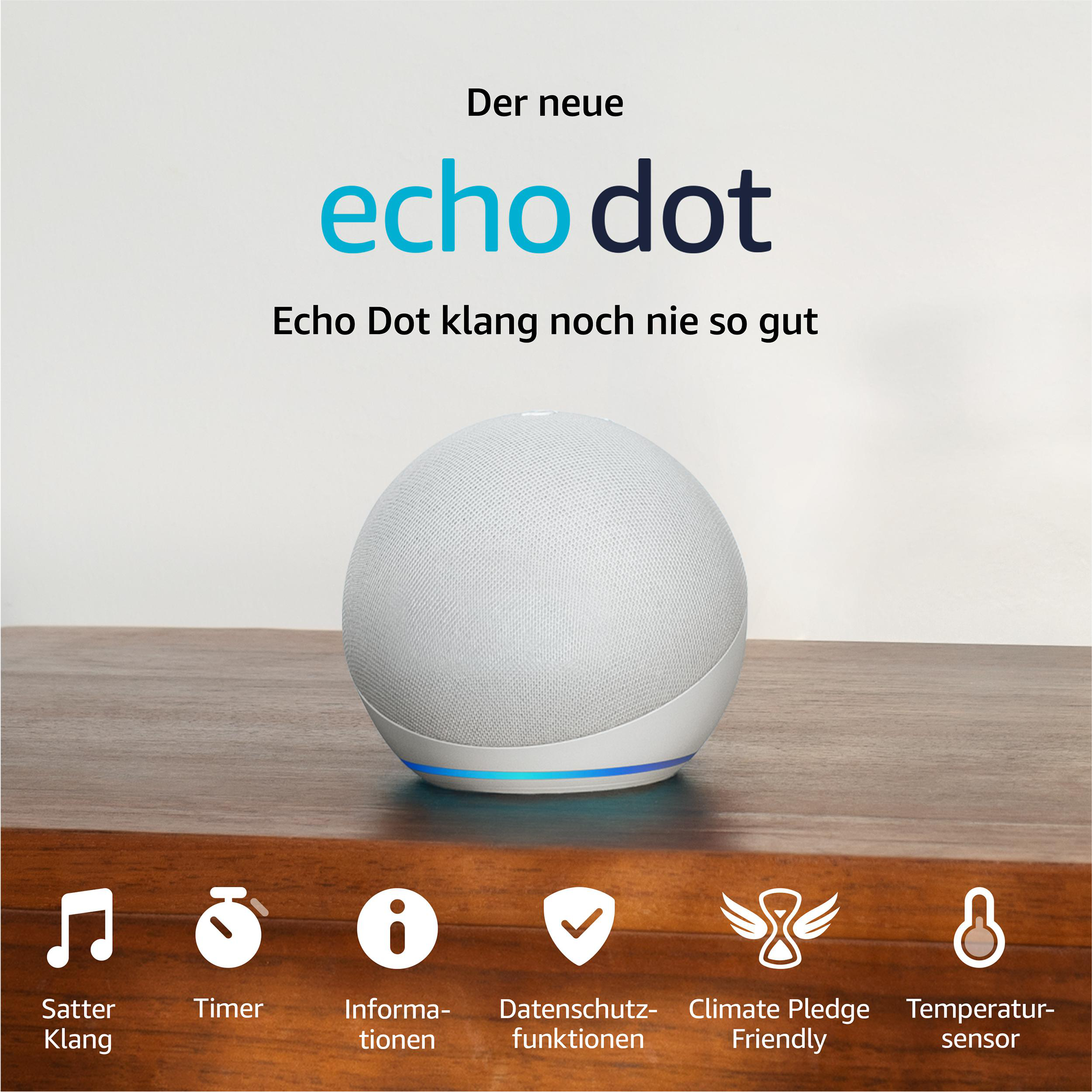 Weißer Echo Dot Lautsprecher auf Holztisch. Text: 'Echo Dot Klang noch nie so gut'.