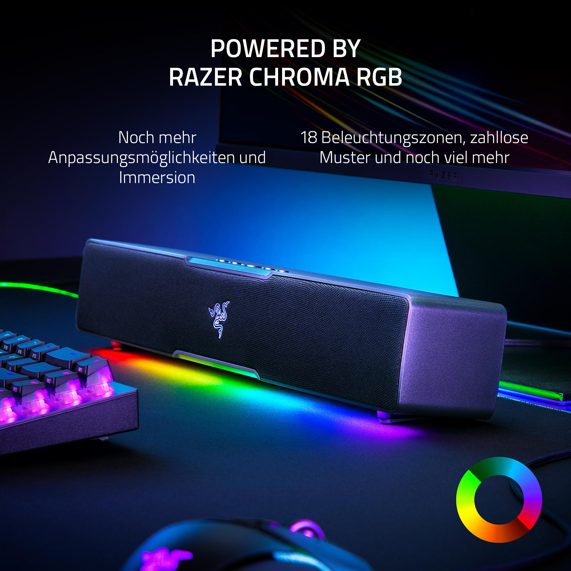 Razer Chroma RGB Soundbar auf dem Schreibtisch, mit Tastatur und Maus. Bunte Lichteffekte werden gezeigt.