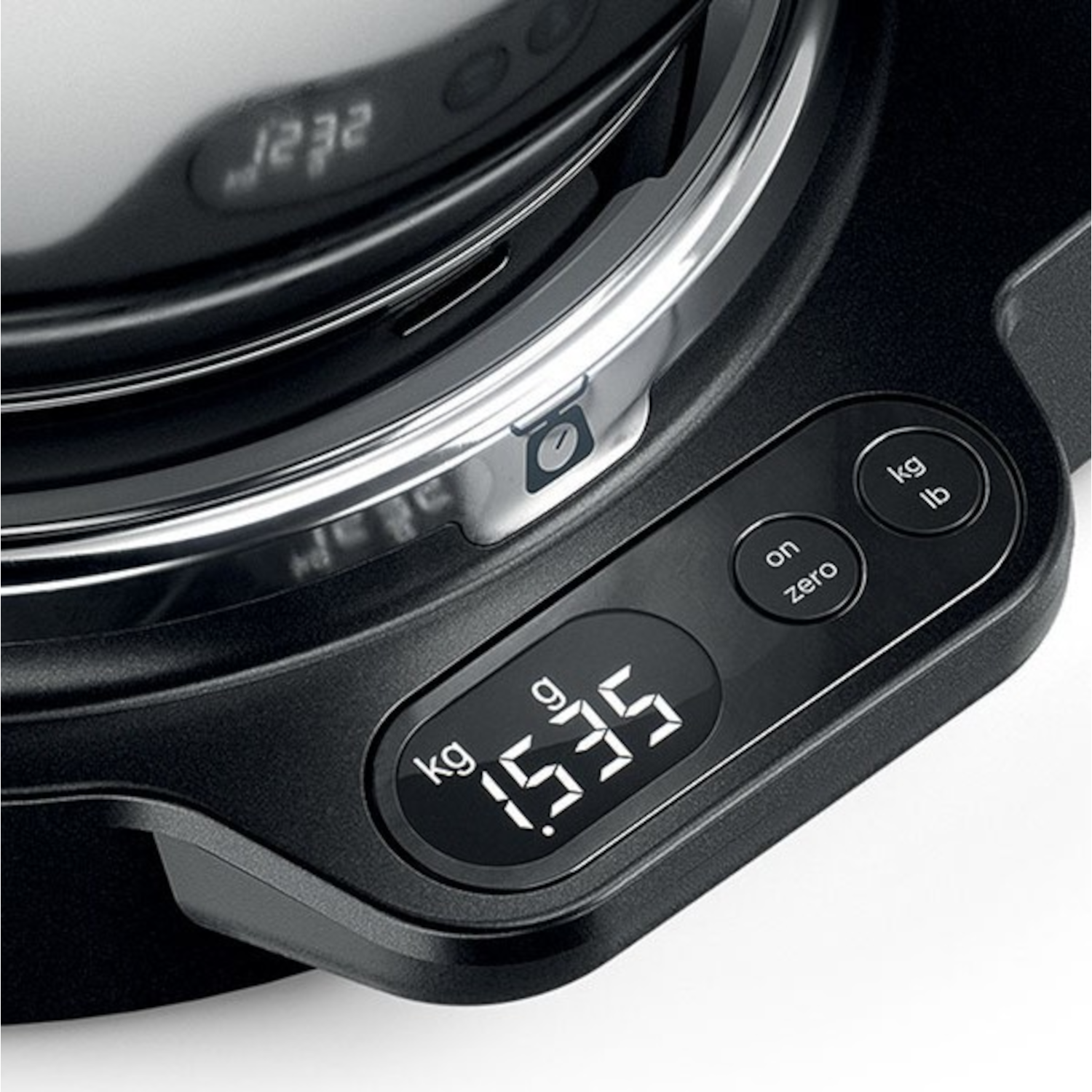 Close-up of a black stand mixer base with a digital scale displaying 1.535 kg.