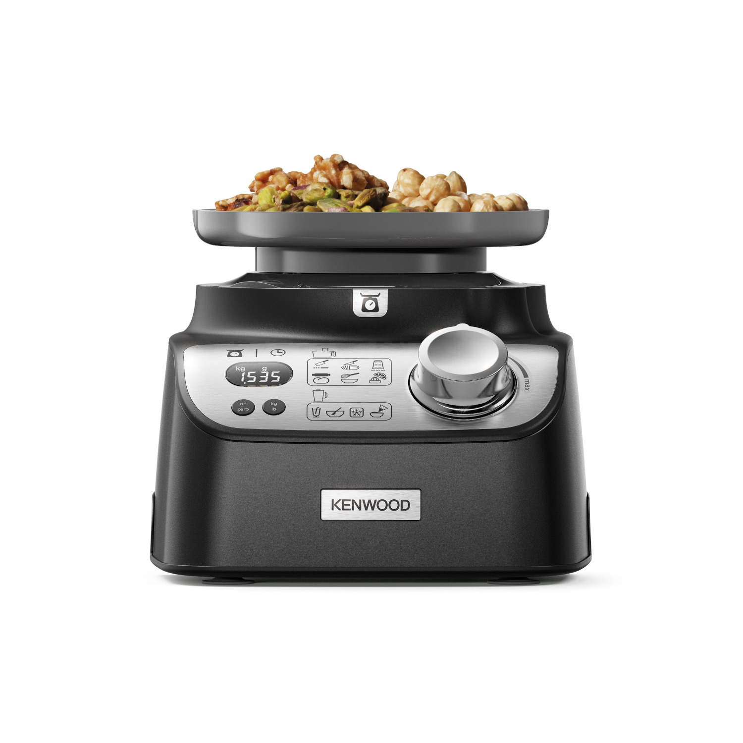 A black Kenwood kitchen machine with food on top. The machine has a dial and a digital display.