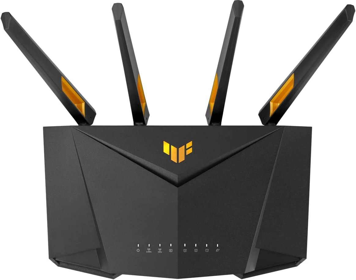 Routeur noir avec quatre antennes. Accents dorés. Fond blanc.
