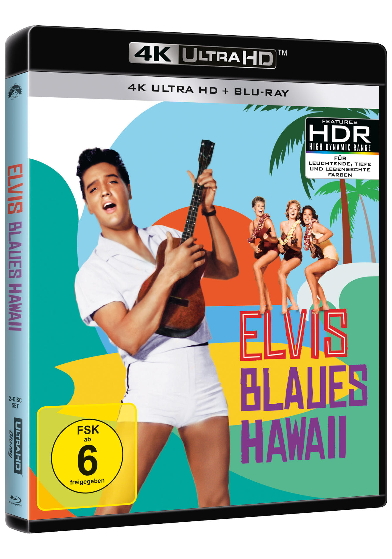 Elvis mit weißem Outfit und Ukulele. Drei Frauen in Bikinis stehen hinter ihm.