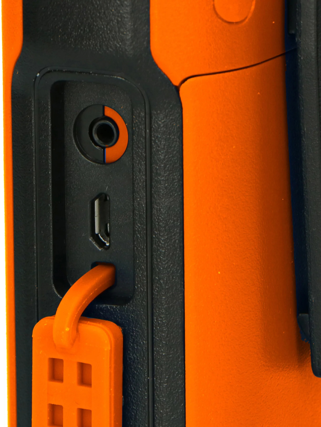 Close-up of an orange and black device with a headphone and USB port.  Orange key ring attached.