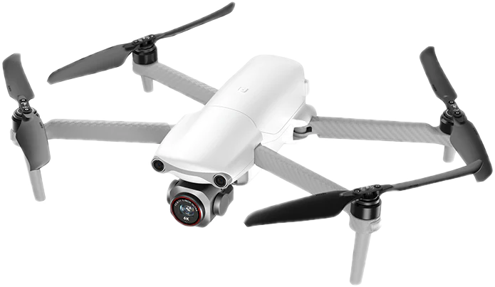 Drone blanc avec hélices noires, une caméra et un design compact.