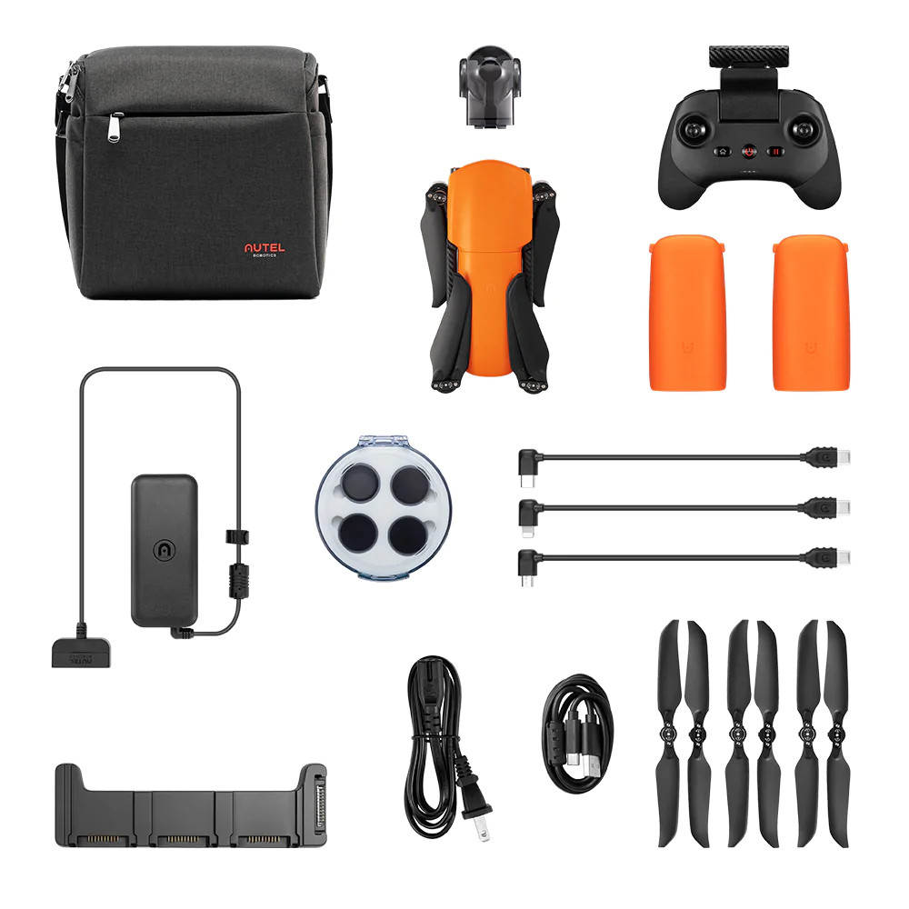 Drone kit with drone, controller, batteries, charger, cables, propellers, and carrying bag.