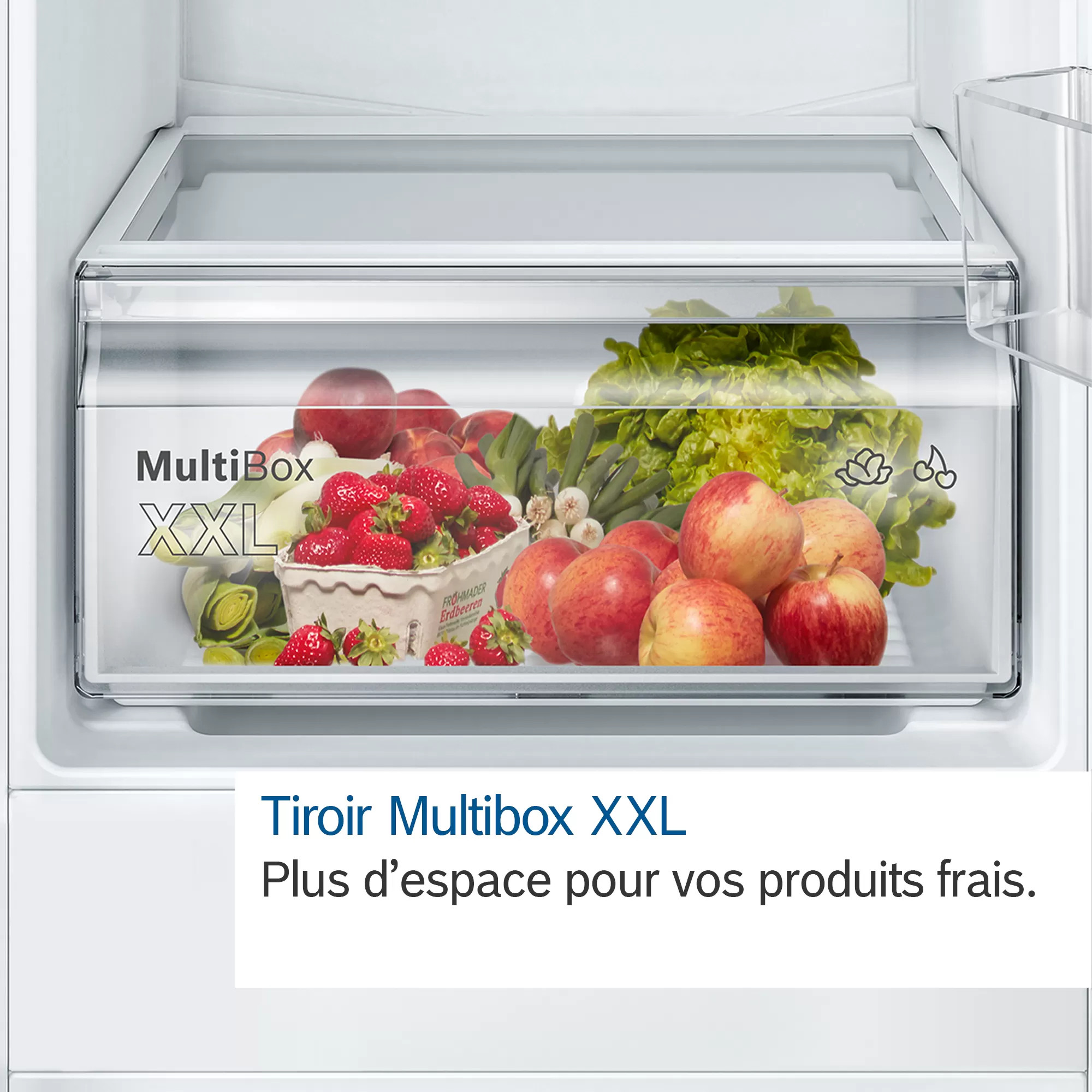 Een koelkastlade vol met vers fruit en groenten, met tekst.