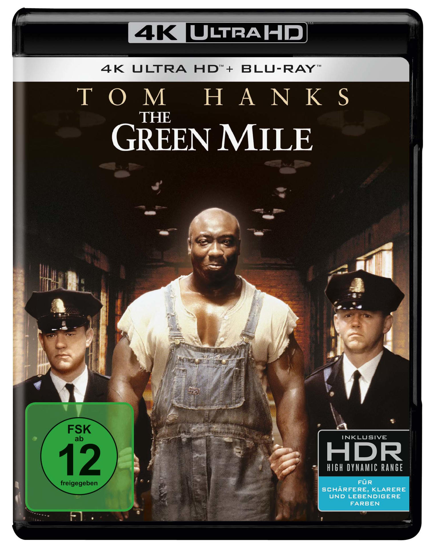 DVD-Cover für The Green Mile, mit Tom Hanks und Michael Clarke Duncan, mit Gefängniswärtern.