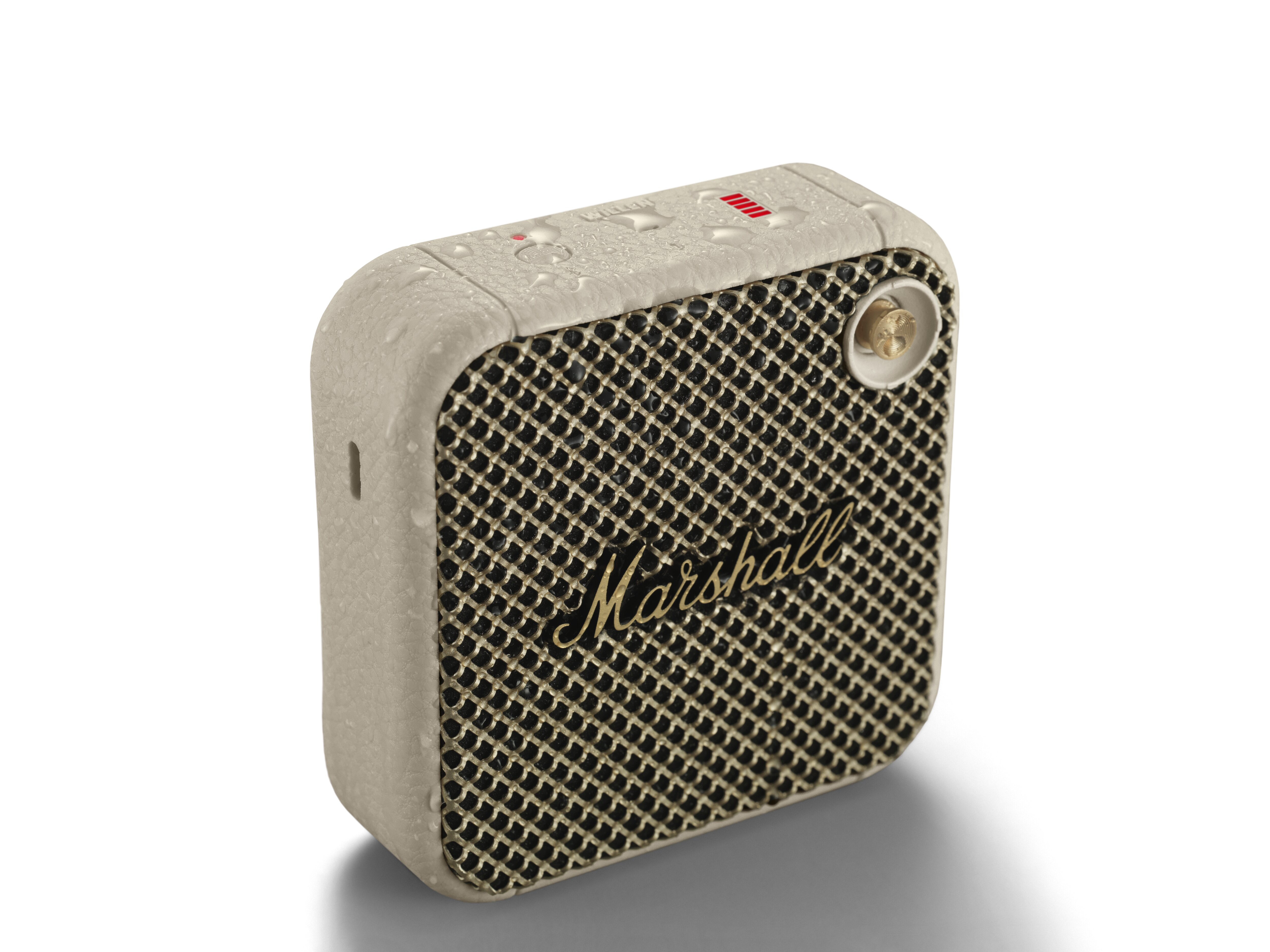 Ein kleiner Marshall-Lautsprecher. Es ist beige und hat einen schwarzen Grill.