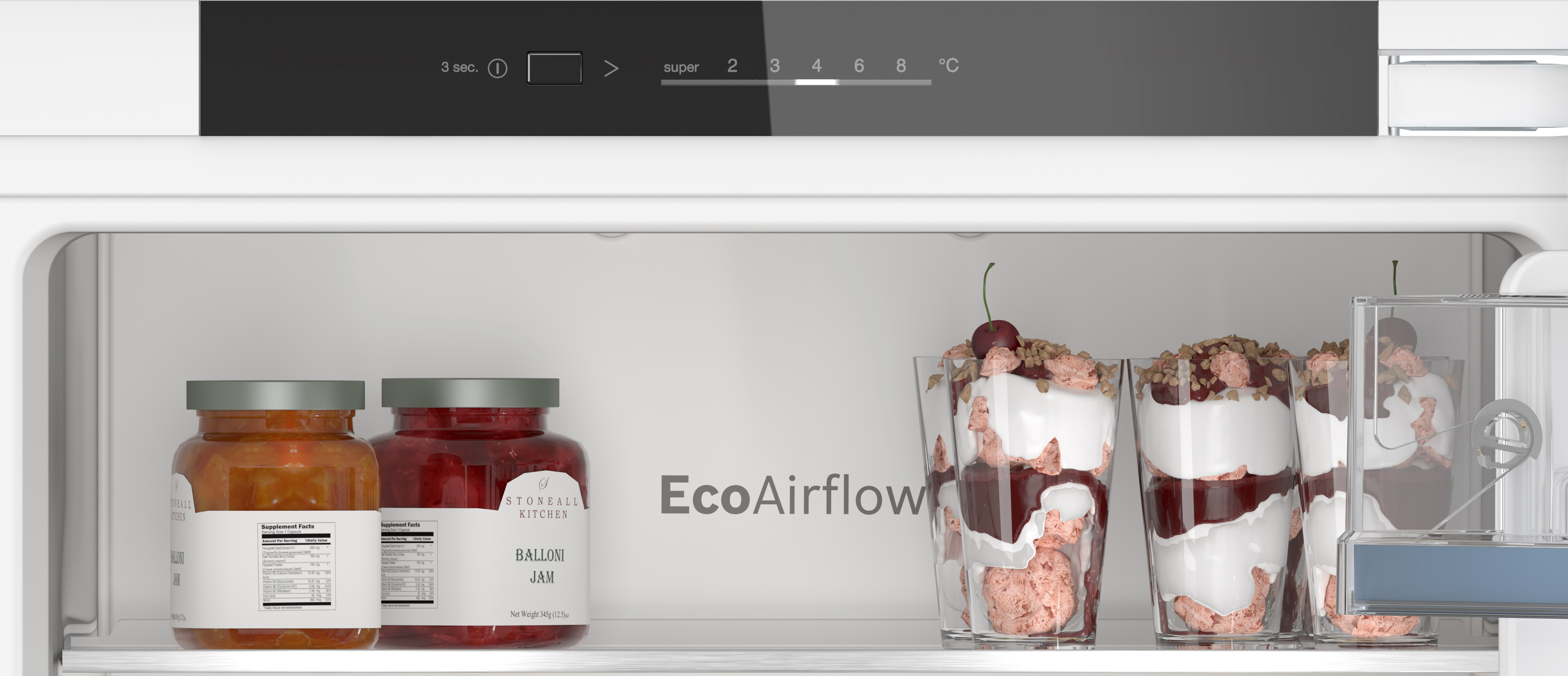 A refrigerator interior with jars of jam and parfaits in clear glasses. It shows a digital display.