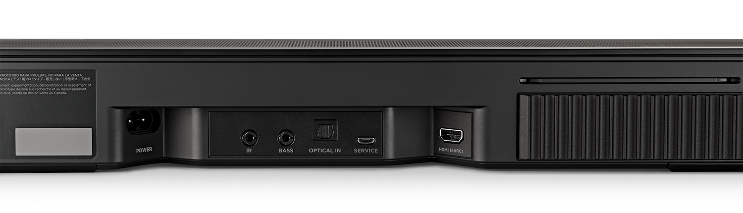 Achterpaneel van een soundbar met stroom, diverse ingangspoorten en labels.