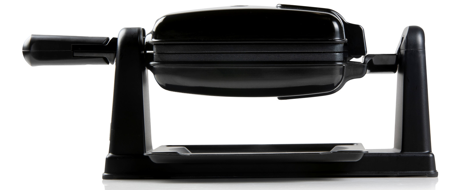 Black waffle maker on a white background. It is open, showing the waffle iron's interior.