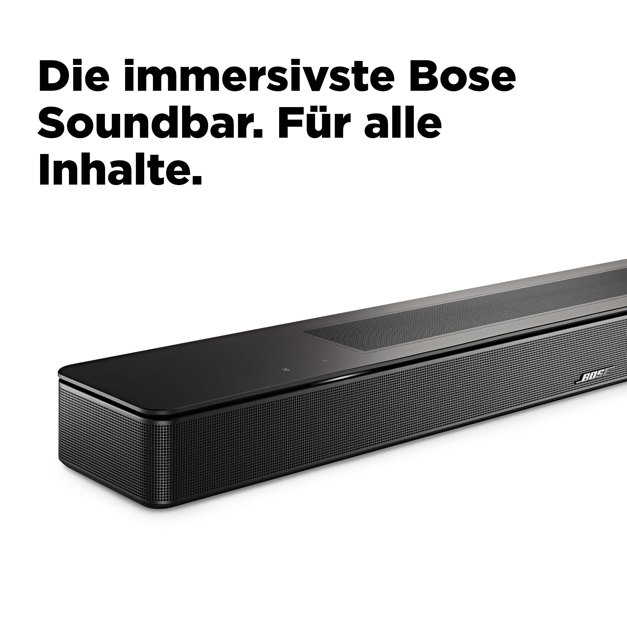 Schwarze Bose-Soundbar auf weißer Oberfläche. Text: 'Die immersivste Bose Soundbar. Für alle Inhalte.'