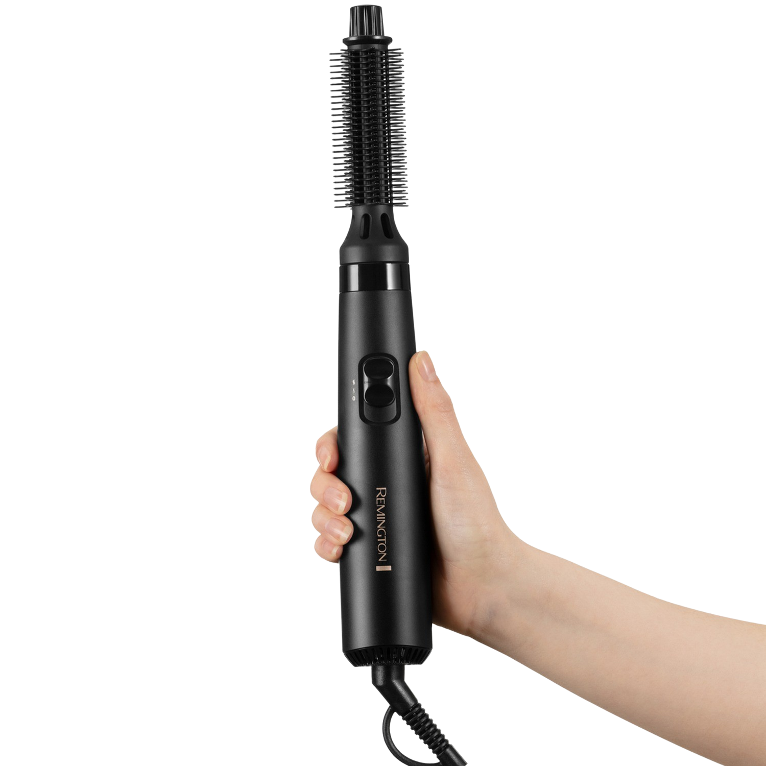 Hand holding a black Remington hair curling brush, cable visible. It is a black background.