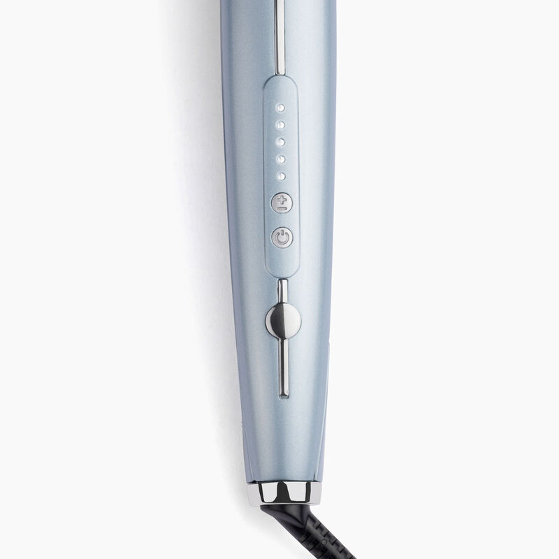 Close-up of a blue curling iron with buttons and a cord.