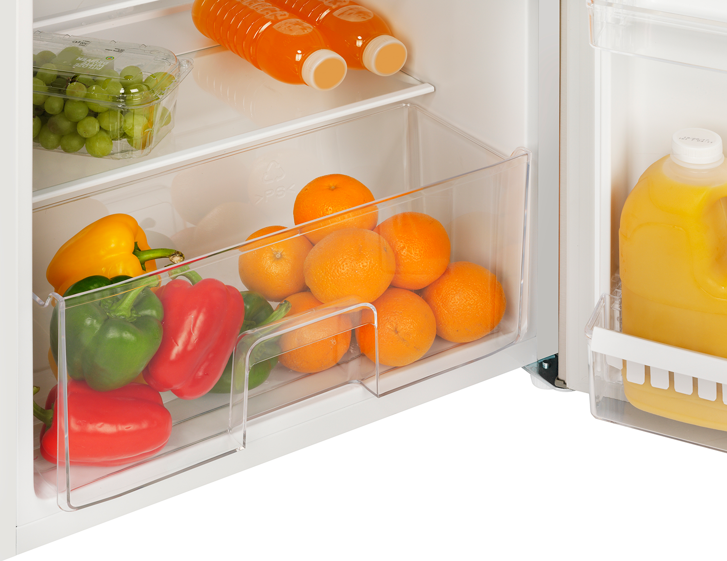 Refrigerator drawer is open, showing oranges, peppers, and grapes. Bottles of juice are above.