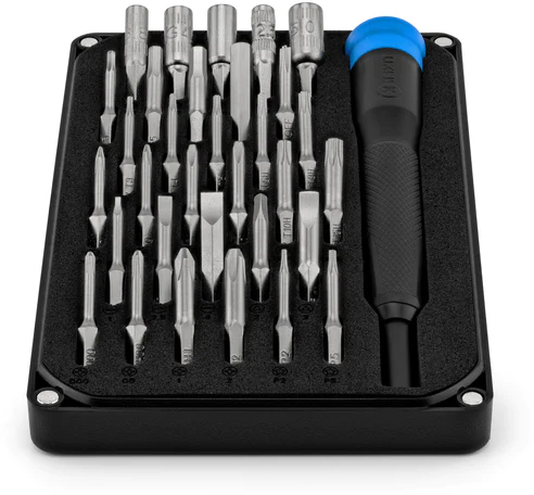 Set of screwdriver bits in a black case with a blue handle.