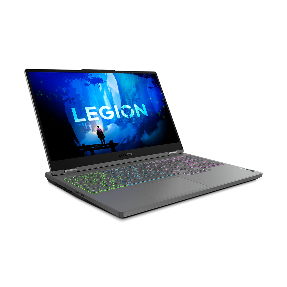 Una computadora portátil gris está sobre una superficie negra. Su pantalla muestra un gráfico azul y verde.