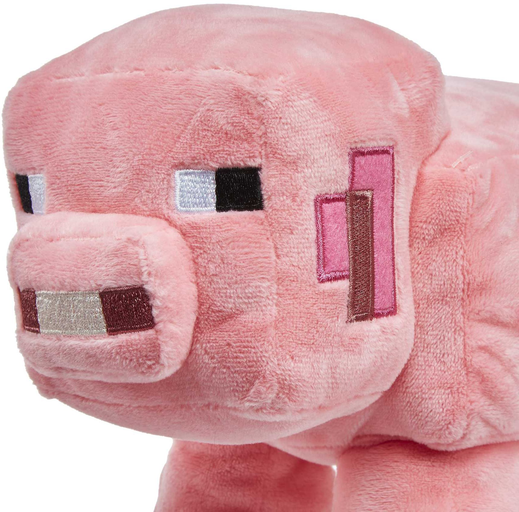 Rosa Minecraft Schwein Plüschtier. Das Schwein hat blockartige Merkmale und ist auf weißem Hintergrund.